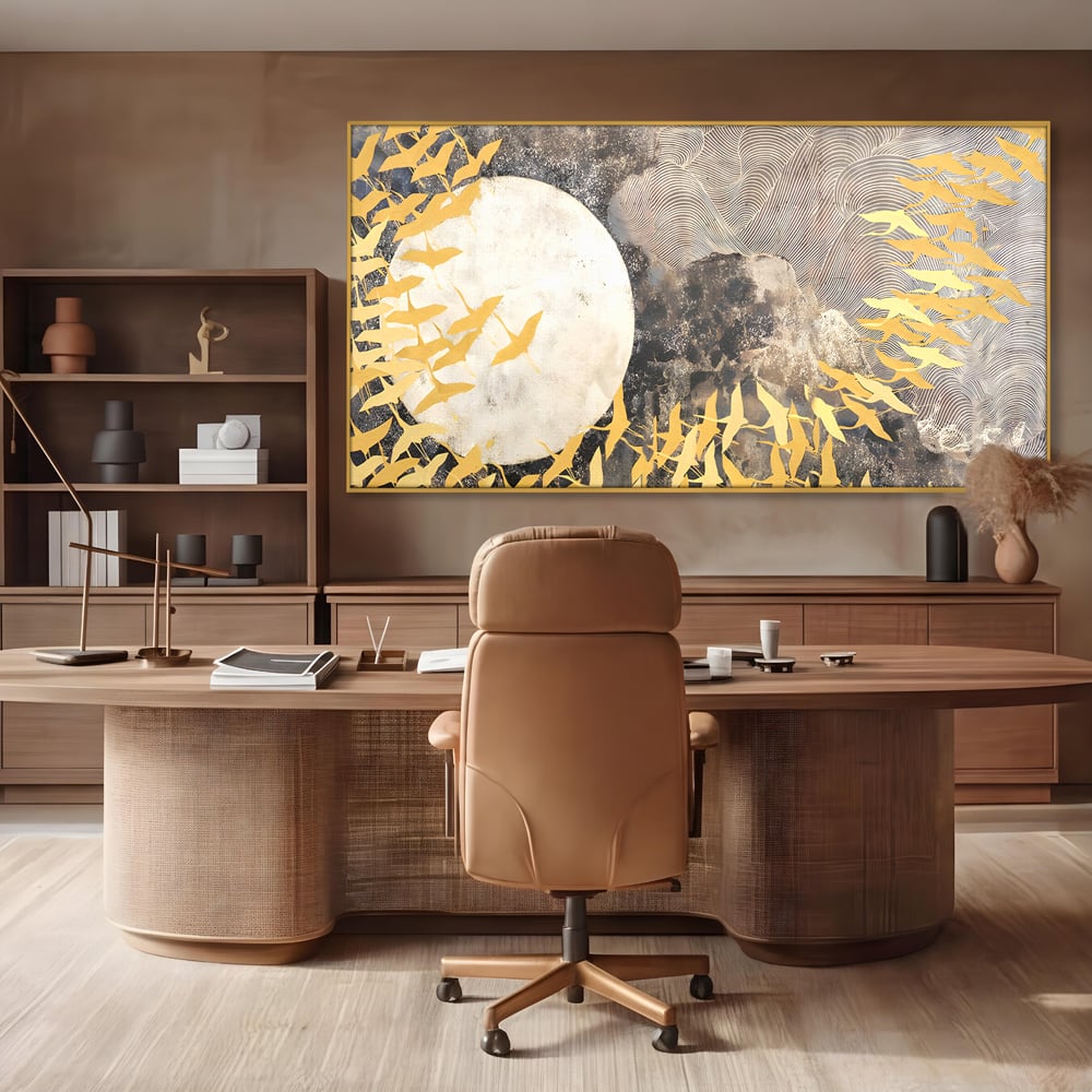 Tablou canvas cu tablou canvas cu pasari aurii si luna, in rama de aluminiu auriu, pe perete intr-un birou